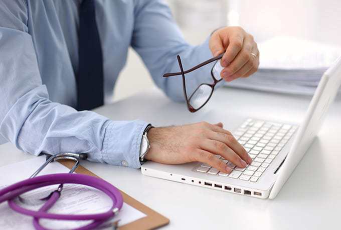 Health professional working at his desk