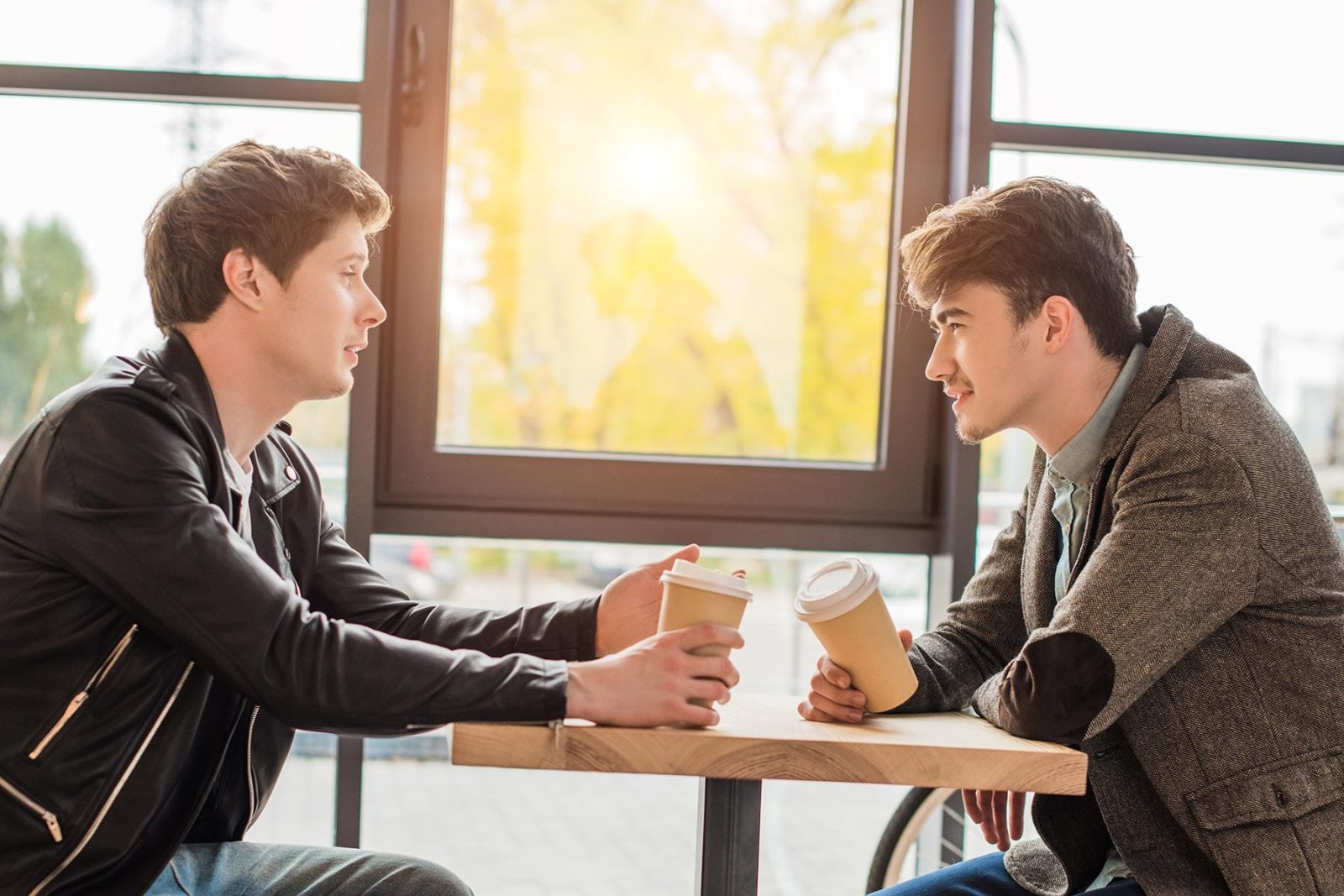 Two men sat together discussing suicide