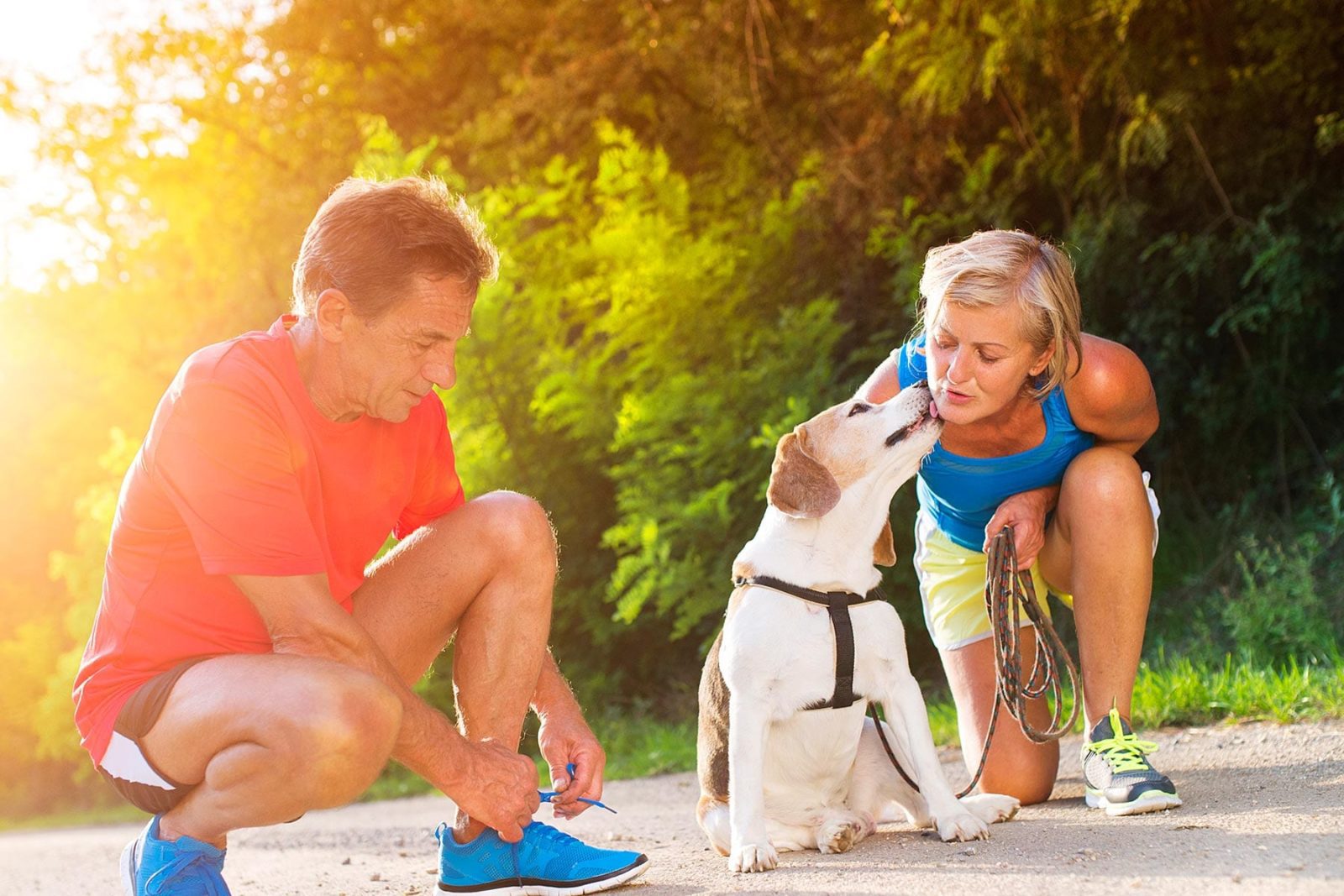 Self care looking after yourself couple going for a run with their pet dog