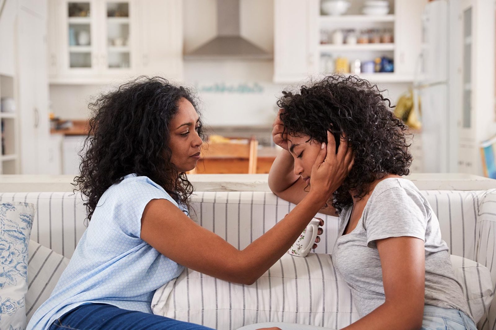 Supporting adolescents: Mother comforting her daughter bereaved by suicide