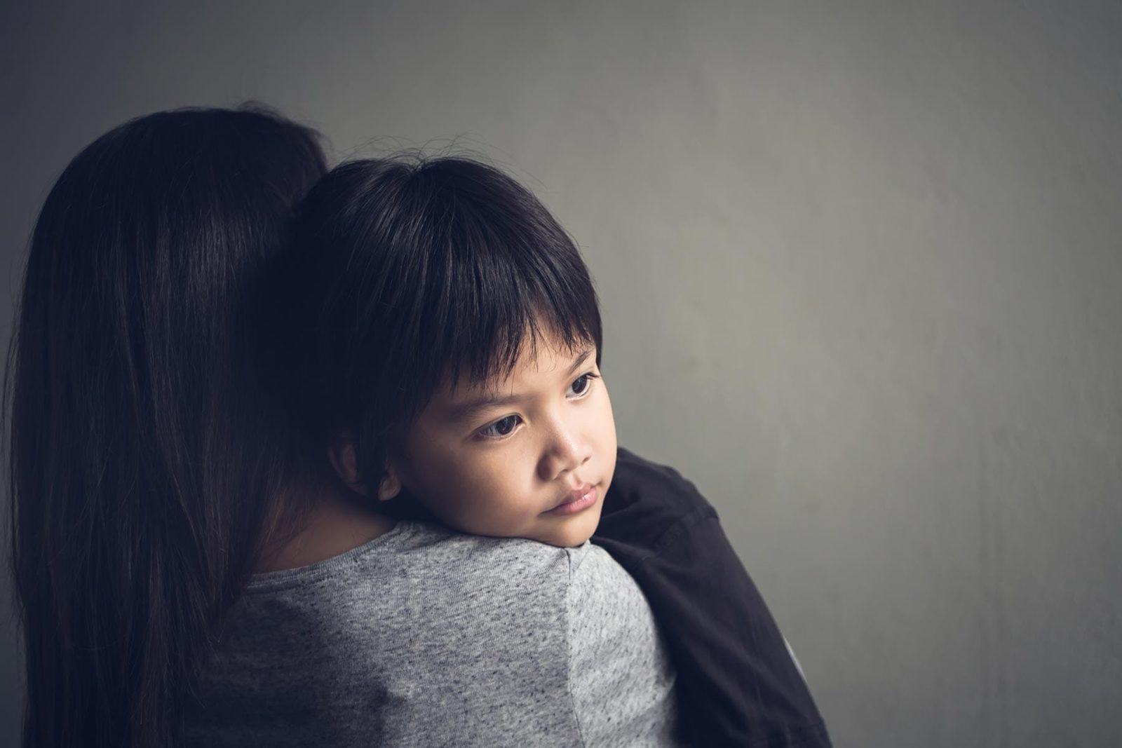 Supporting Children: Child being held by his mother after a suicide