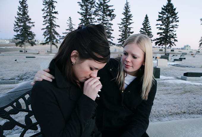Women supporting her friend after a suicide attempt