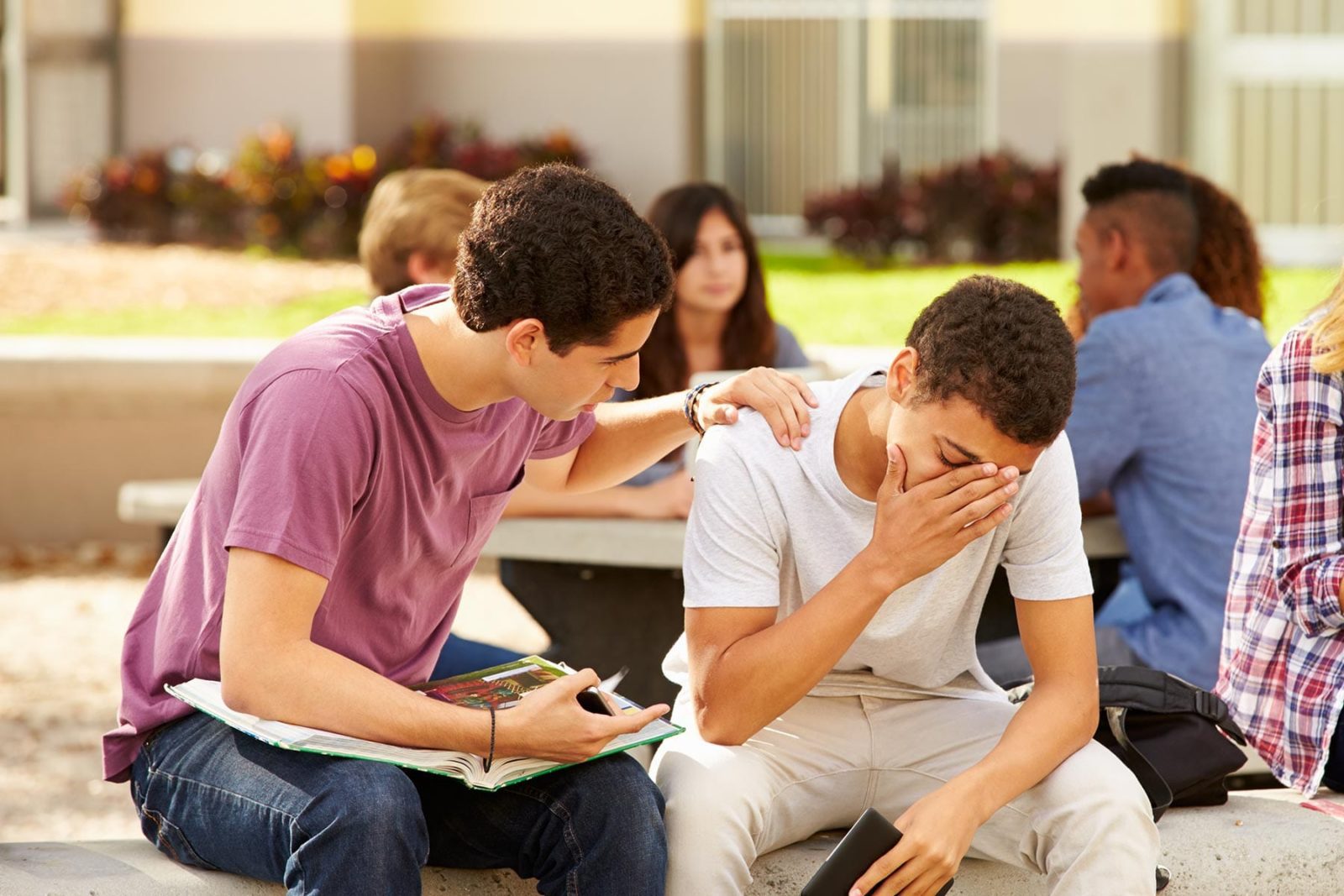 A student sat supporting someone who is suicidal