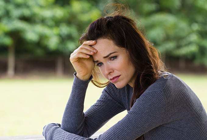Women sat trying to manage a panic attack