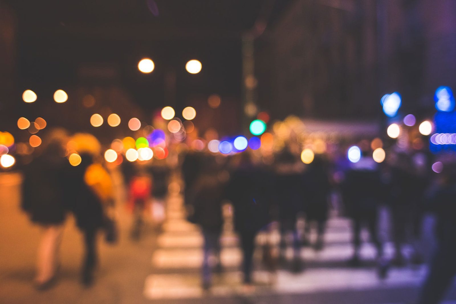 Blurred image of people walking in a city