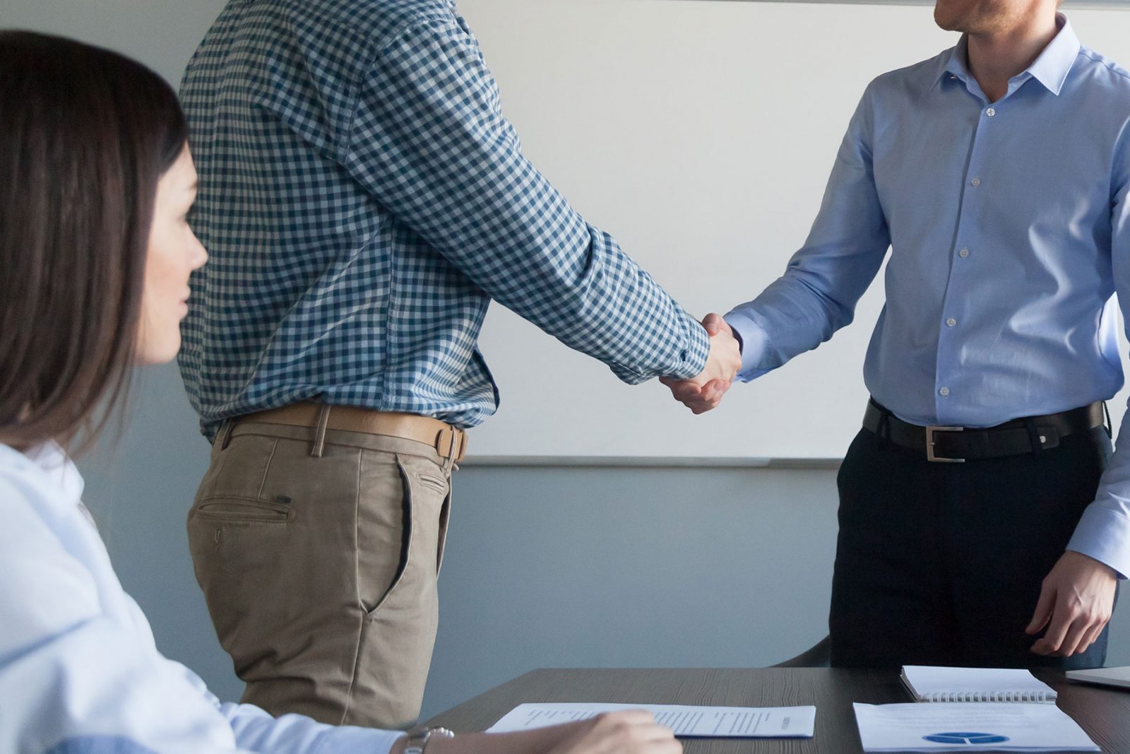 Work colleagues shaking hands