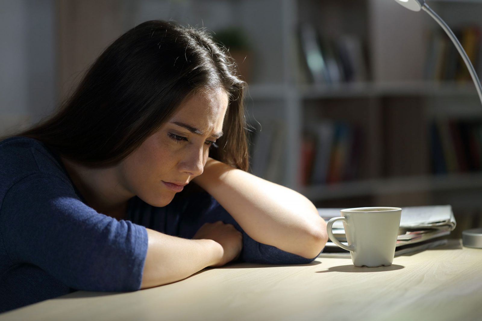 Anxious looking women sat at home