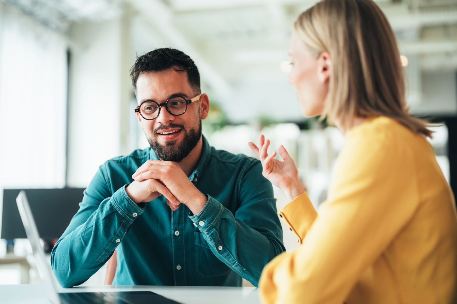 Two people in conversation at work