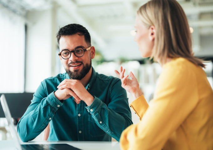 Two people in conversation at work