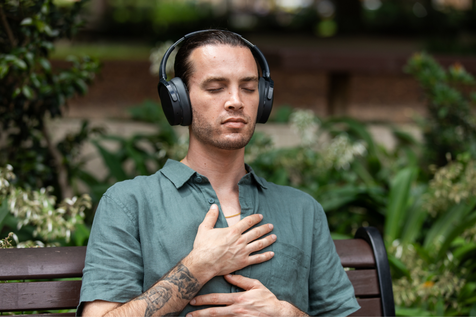 Man sitting in stillness with headphones on